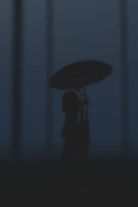 Man with Umbrella in Rain